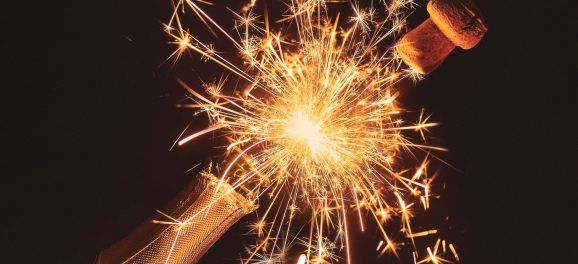 Champagne bottle with sparkler ignited