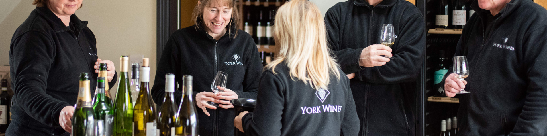 York Wines team stood around a selection of wines drinking wine